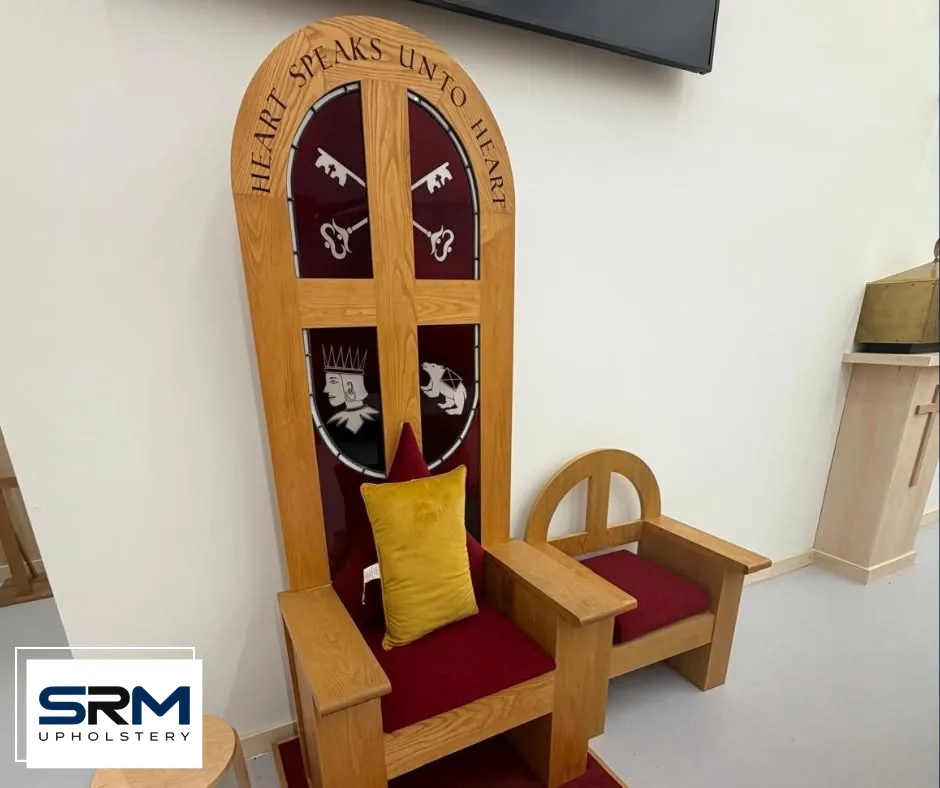 Carved wooden church chair with new red seat and gold cushion
